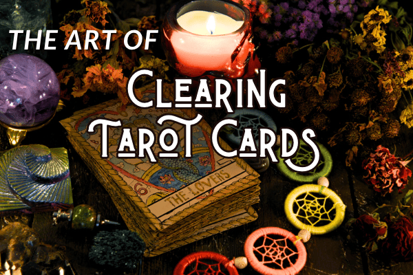 The art of clearing tarot cards with a tarot deck, candles, ad dried herbs